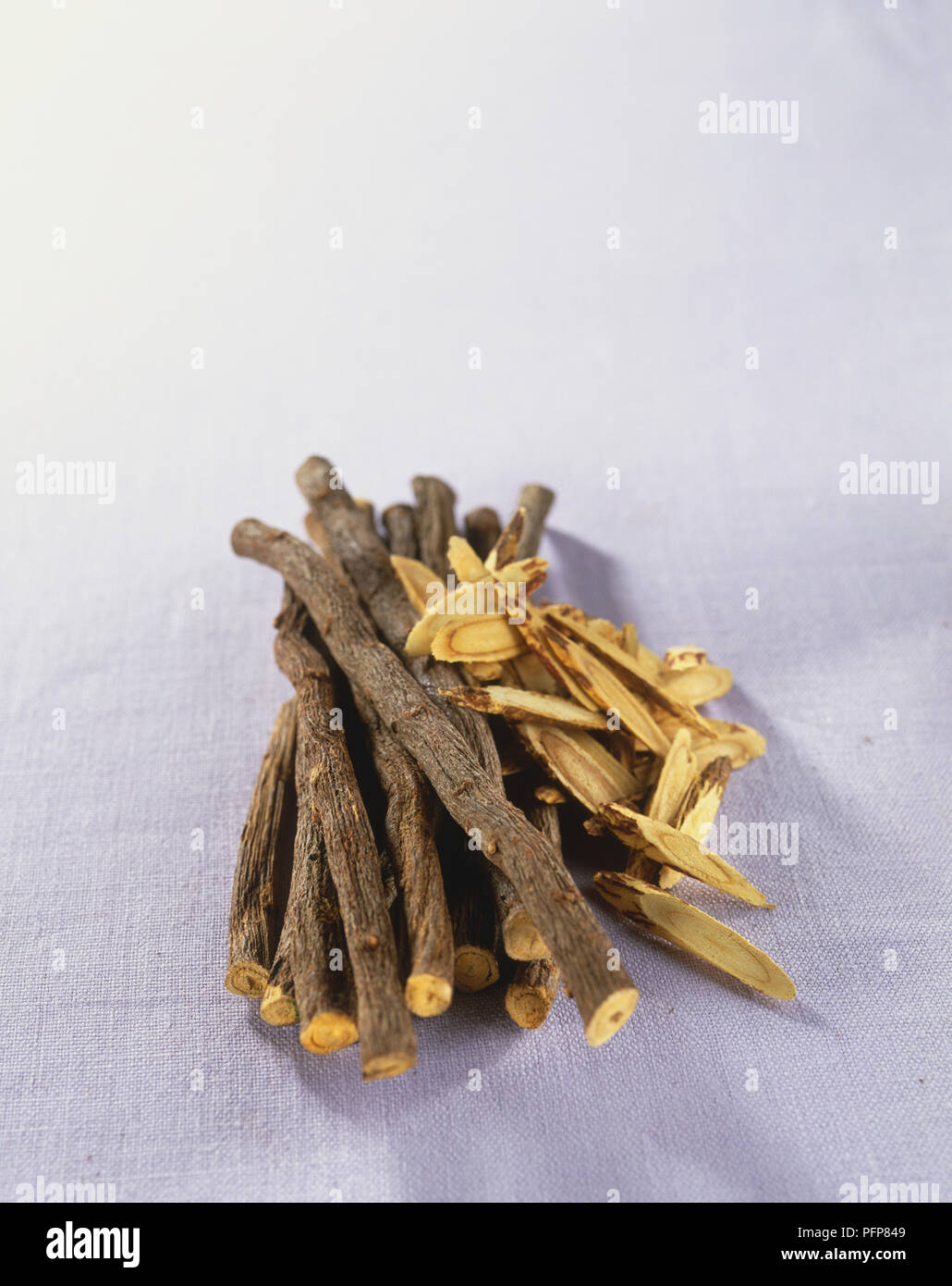 Glycyrrhiza uralensis, dried whole and sliced Liquorice roots, close up