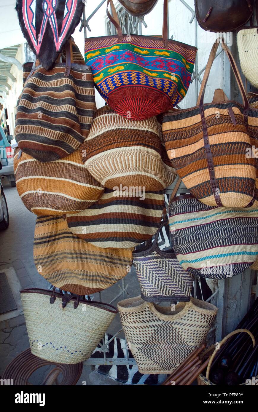 Kenya, Mombasa, bags for sale outside souvenir shop Stock Photo