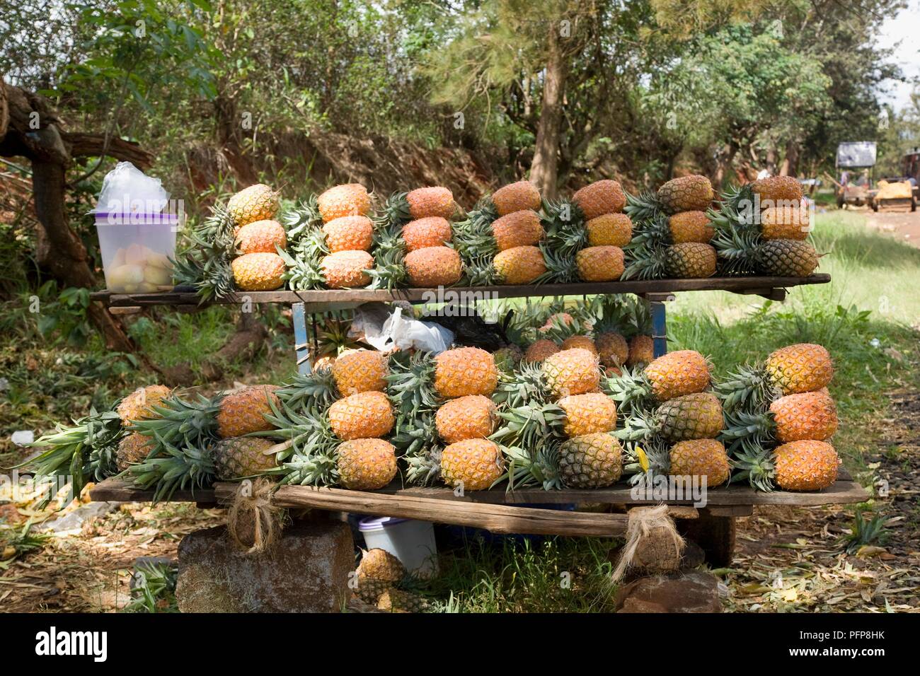 Kenya, near Thika, pineapples for sale on roadside Stock Photo Alamy