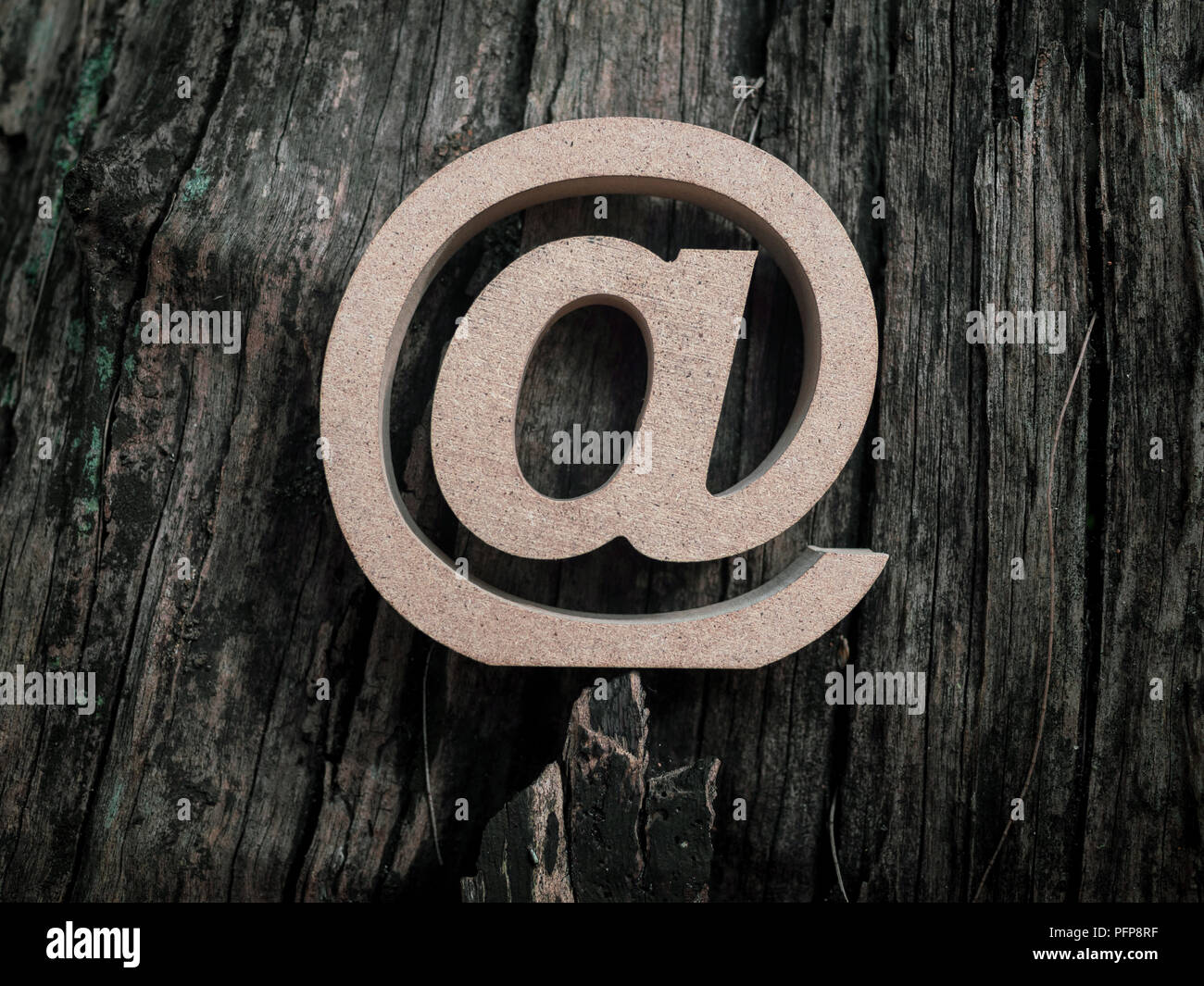 Wooden E-mail address symbol, arroba icon on old dry wooden texture ...