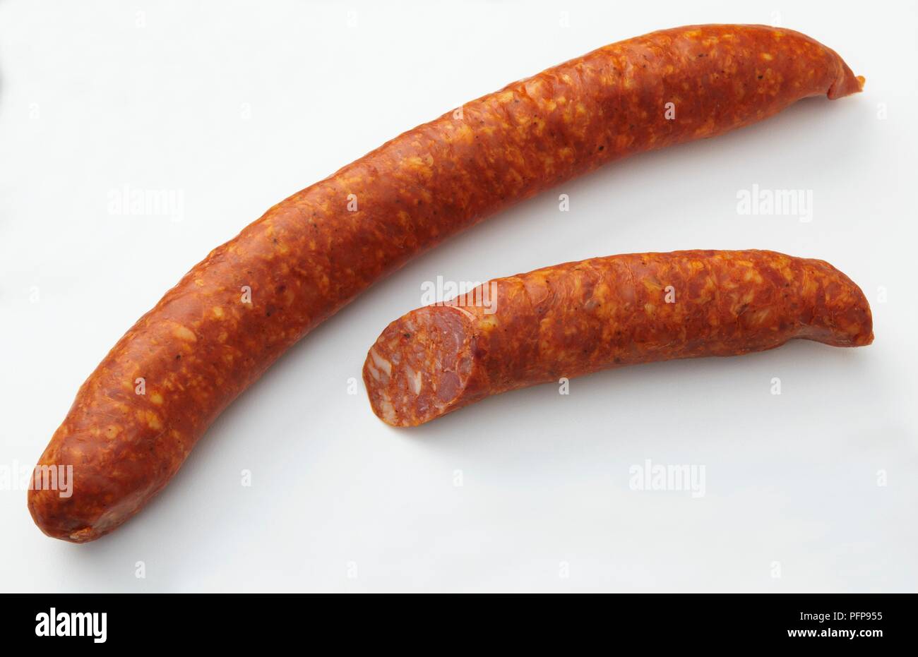Whole and half smoked American Andouille pork sausage Stock Photo Alamy