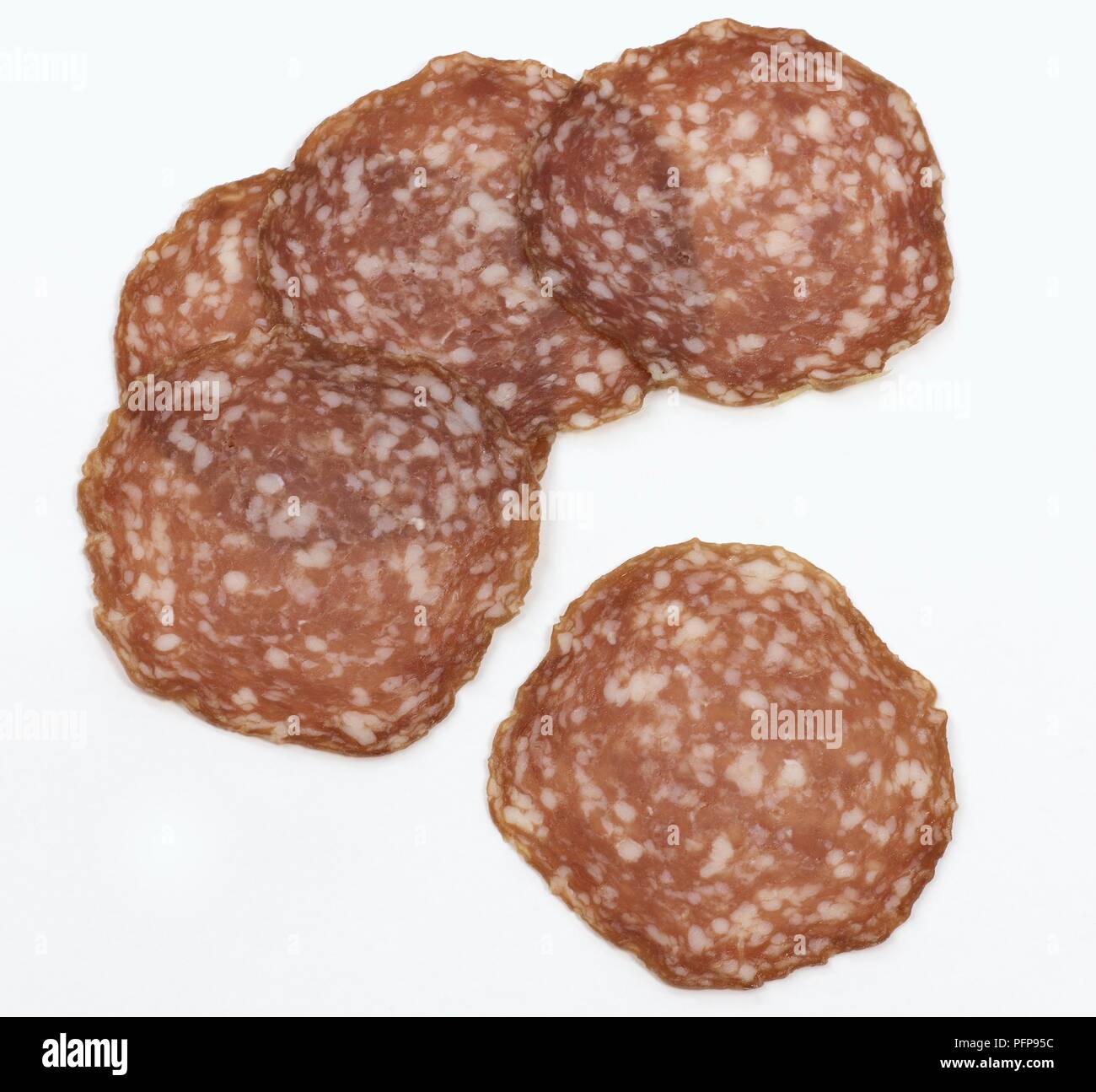 Five slices of Milanese salami Stock Photo Alamy