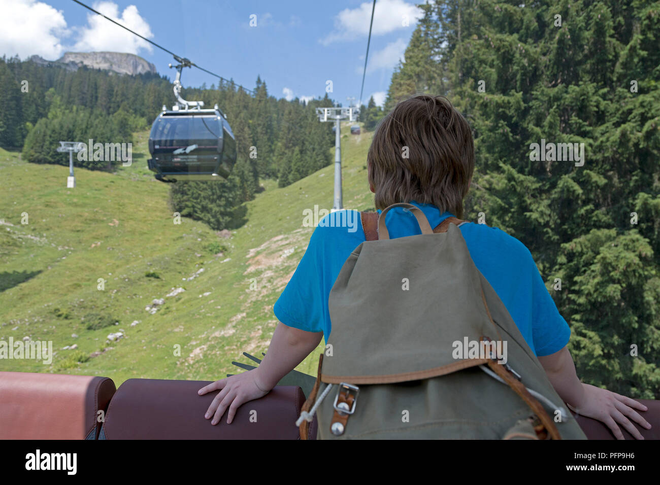 boy in the cable car, Hoher Ifen near Hirschegg, little Walser valley, Austria Stock Photo