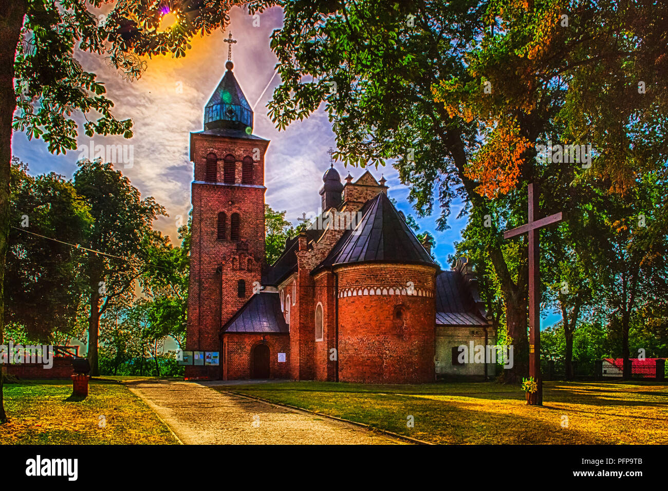 Church in the park illuminated by the setting sun Stock Photo - Alamy
