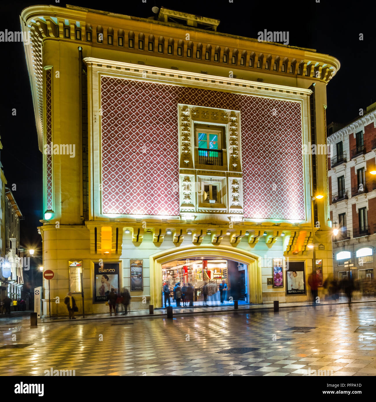 GRANADA, SPAIN - FEBRUARY 21, 2015: Night view of the main facade of Aliatar Cinema (Cine Aliatar), beautiful building in Granada, Spain, designed by  Stock Photo