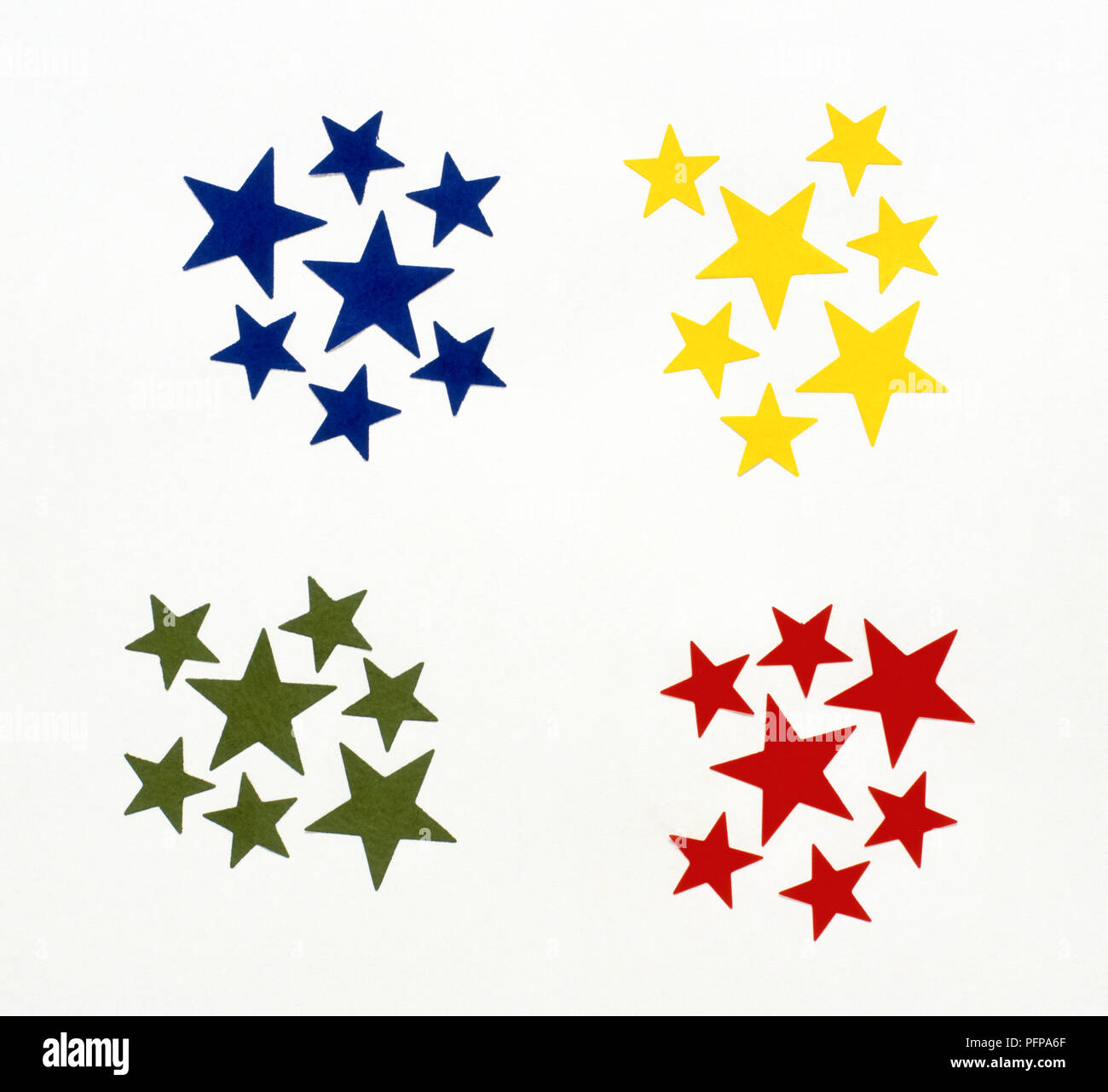 Yellow, blue, green and red stars in clusters Stock Photo - Alamy