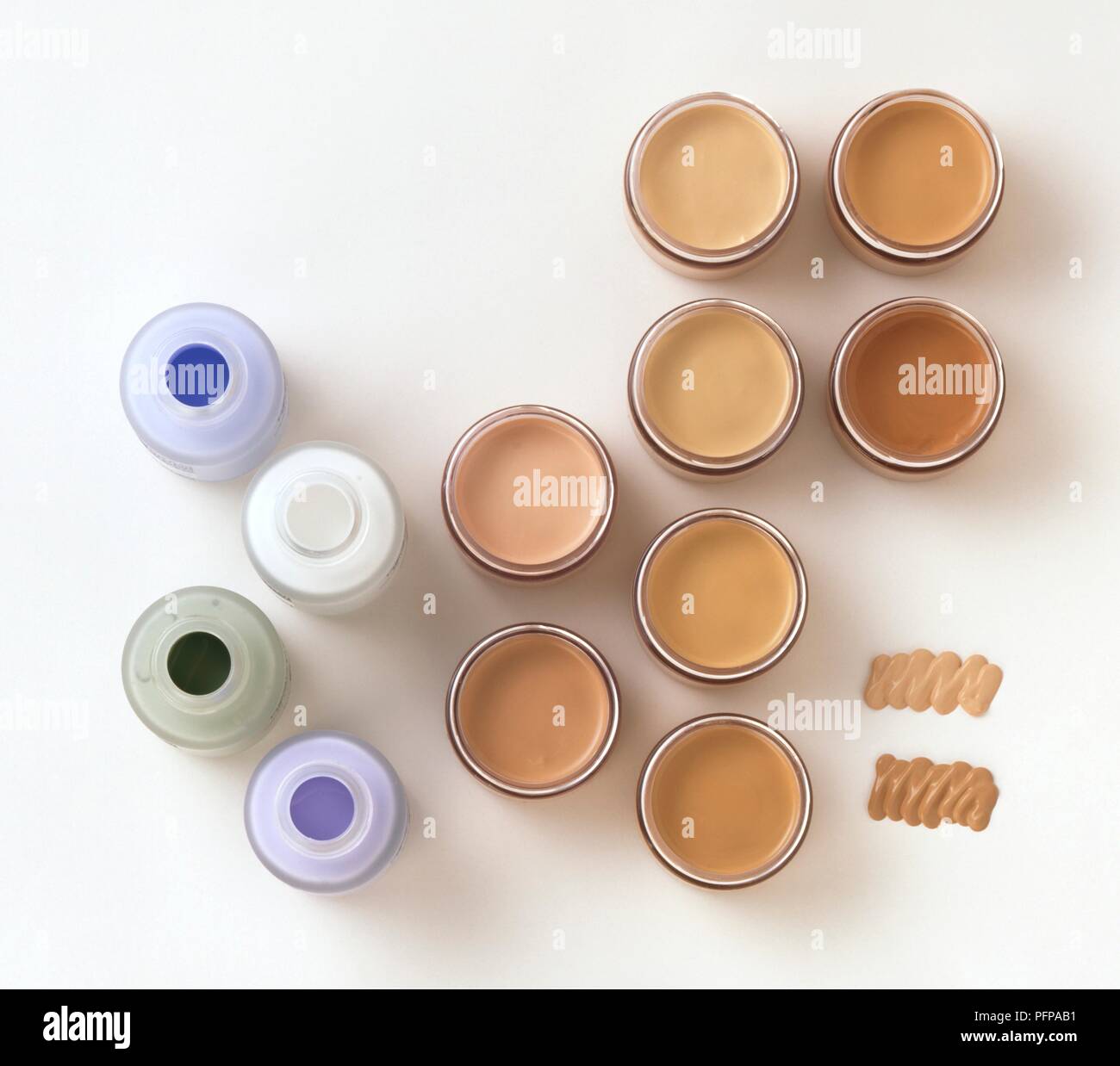 Bottles of skin correction fluids and jar of liquid foundation Stock Photo Alamy
