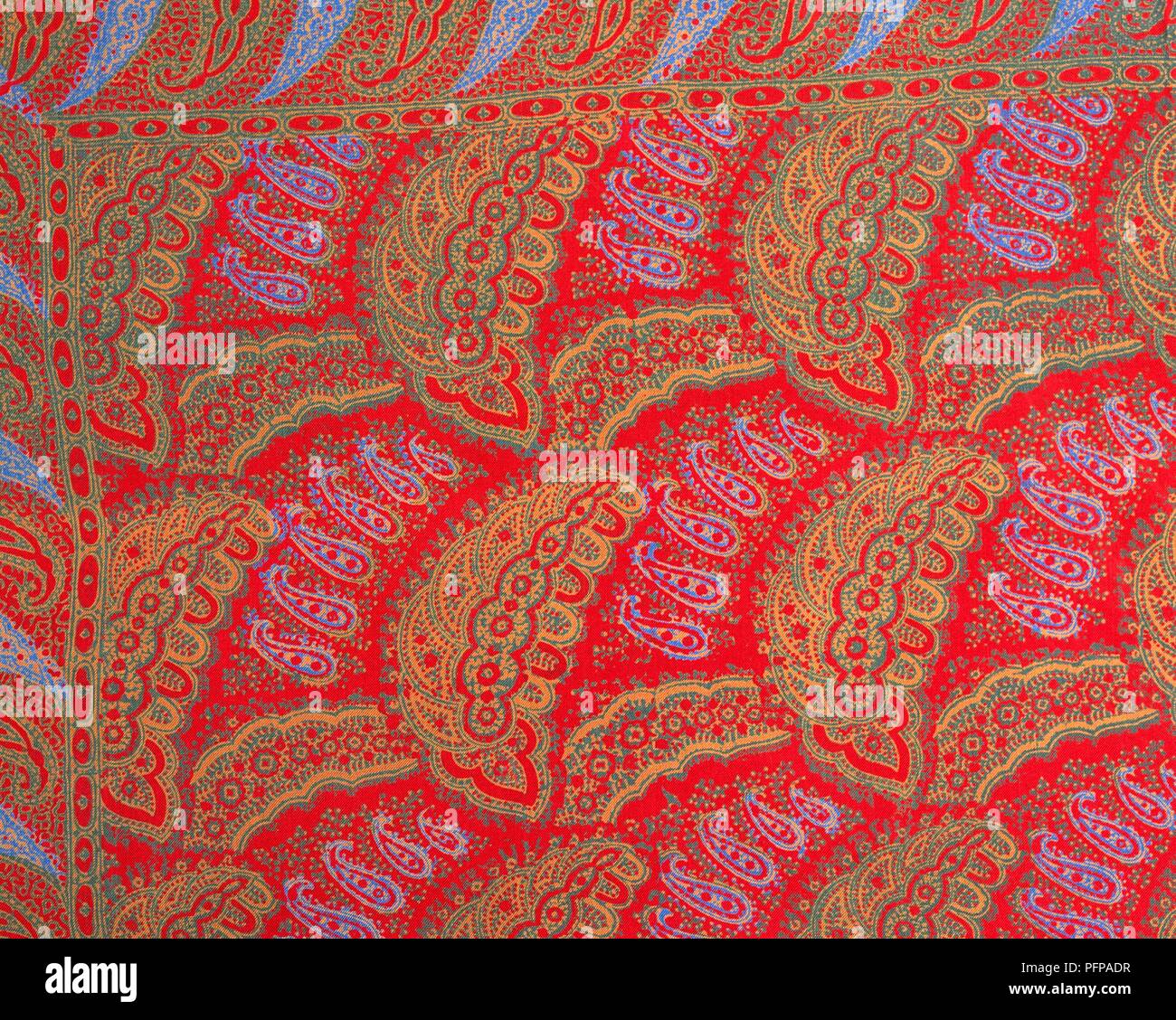 Swatch of red paisley material Stock Photo Alamy