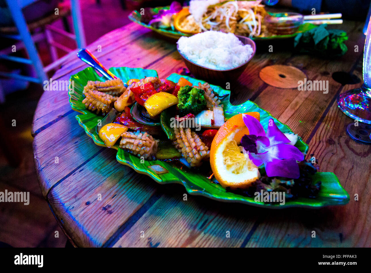 Thai seafood dish on a leaf-shaped plate at Koh Phangan restaurant, Stockholm, Sweden Stock Photo