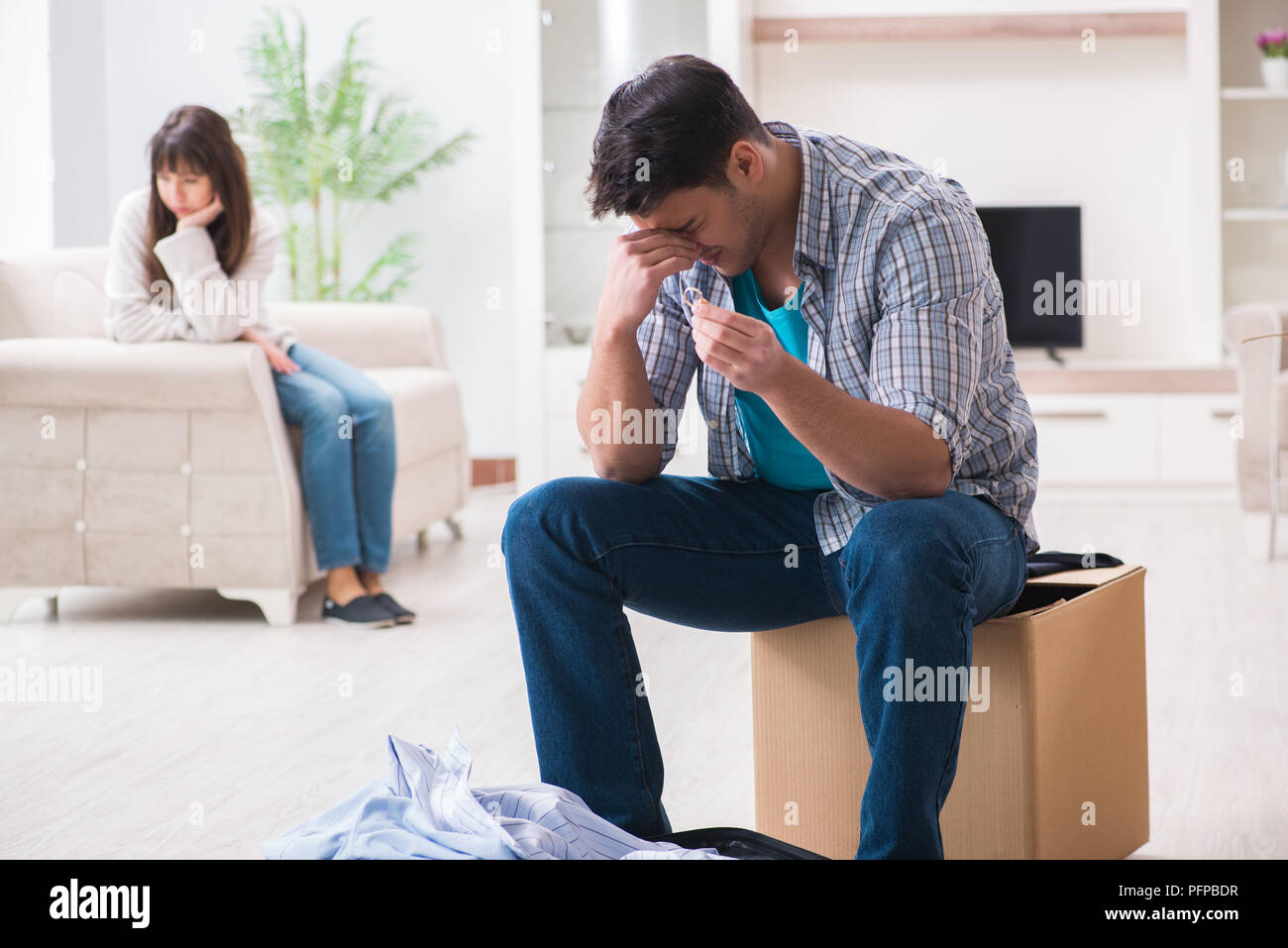 Woman evicting man from house during family conflict Stock Photo Alamy