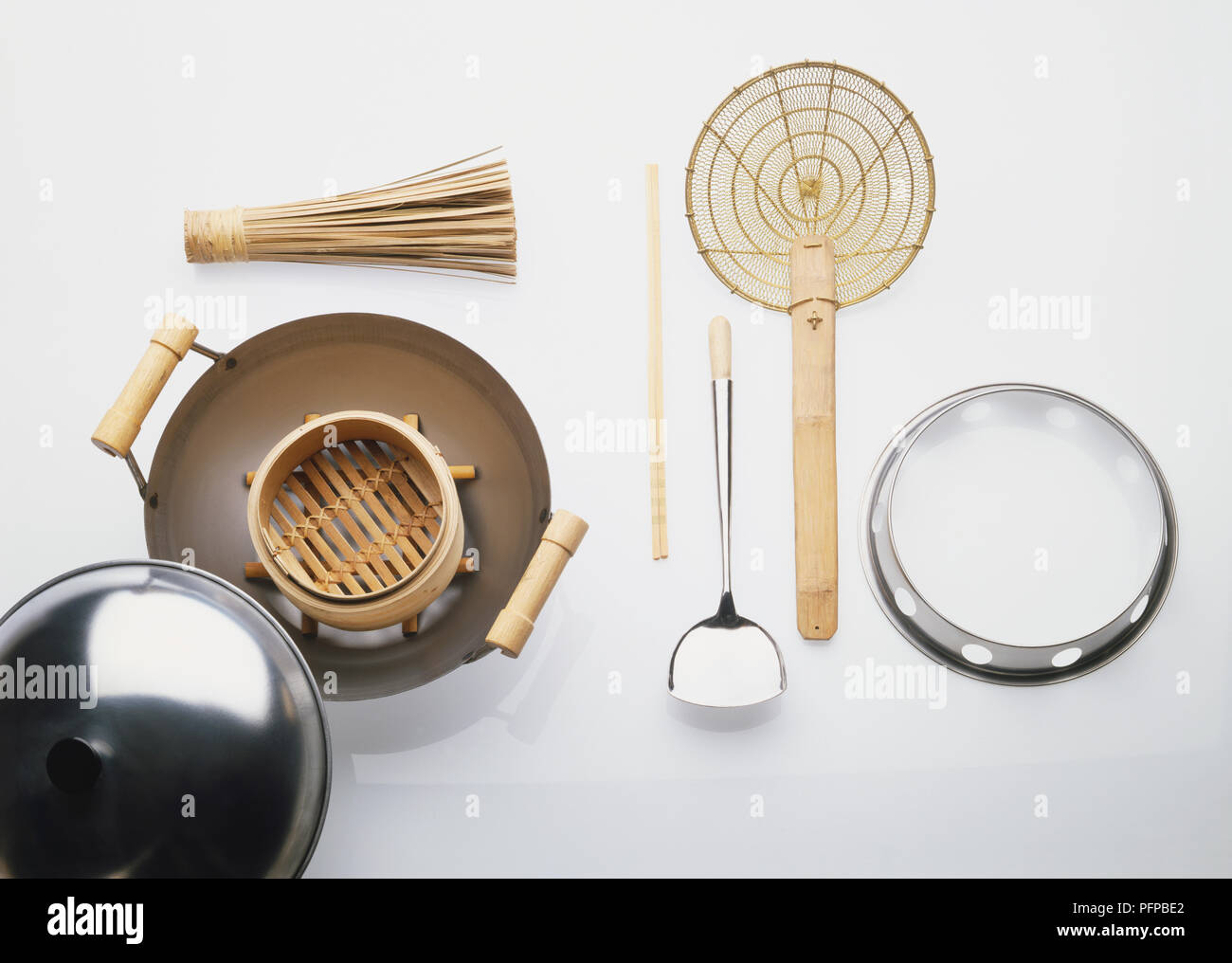 https://c8.alamy.com/comp/PFPBE2/assorted-kitchen-utensils-wok-wok-brush-bamboo-steamer-chopstick-bamboo-strainer-wok-scoop-wok-stand-view-from-above-PFPBE2.jpg