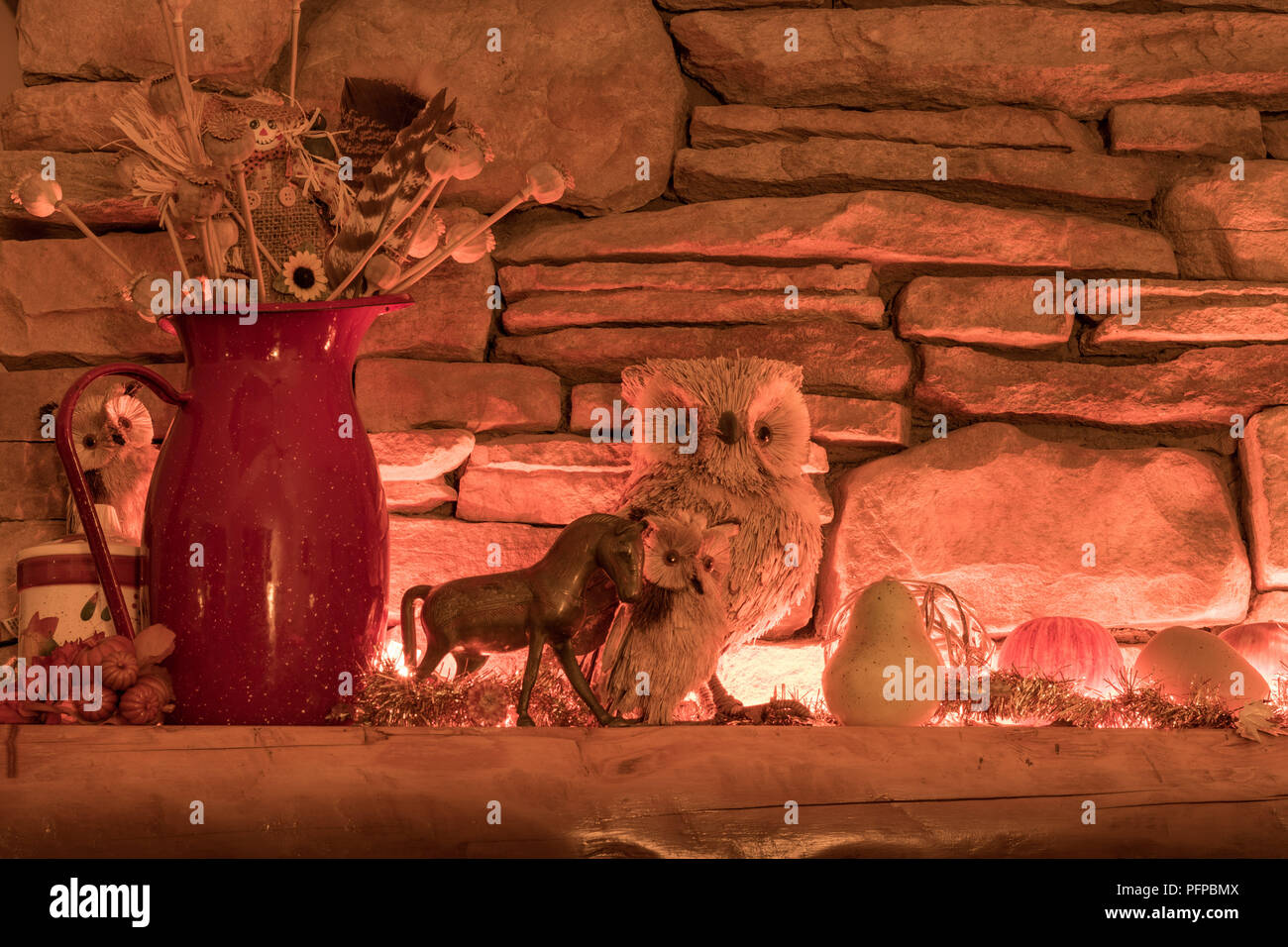Autumn Themed Fireplace Mantel Display Bathed In Warm Light With