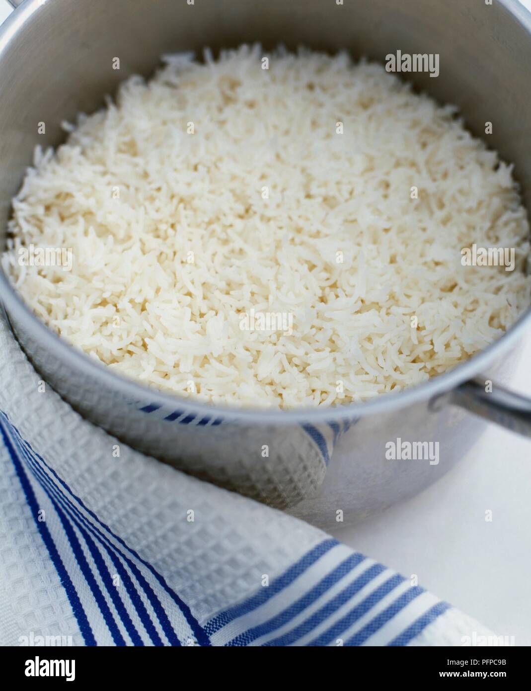 Boiled white rice in large saucepan Stock Photo