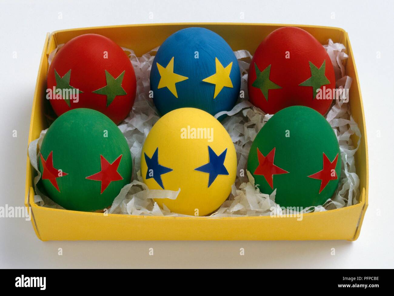 Six colourful eggs in box Stock Photo