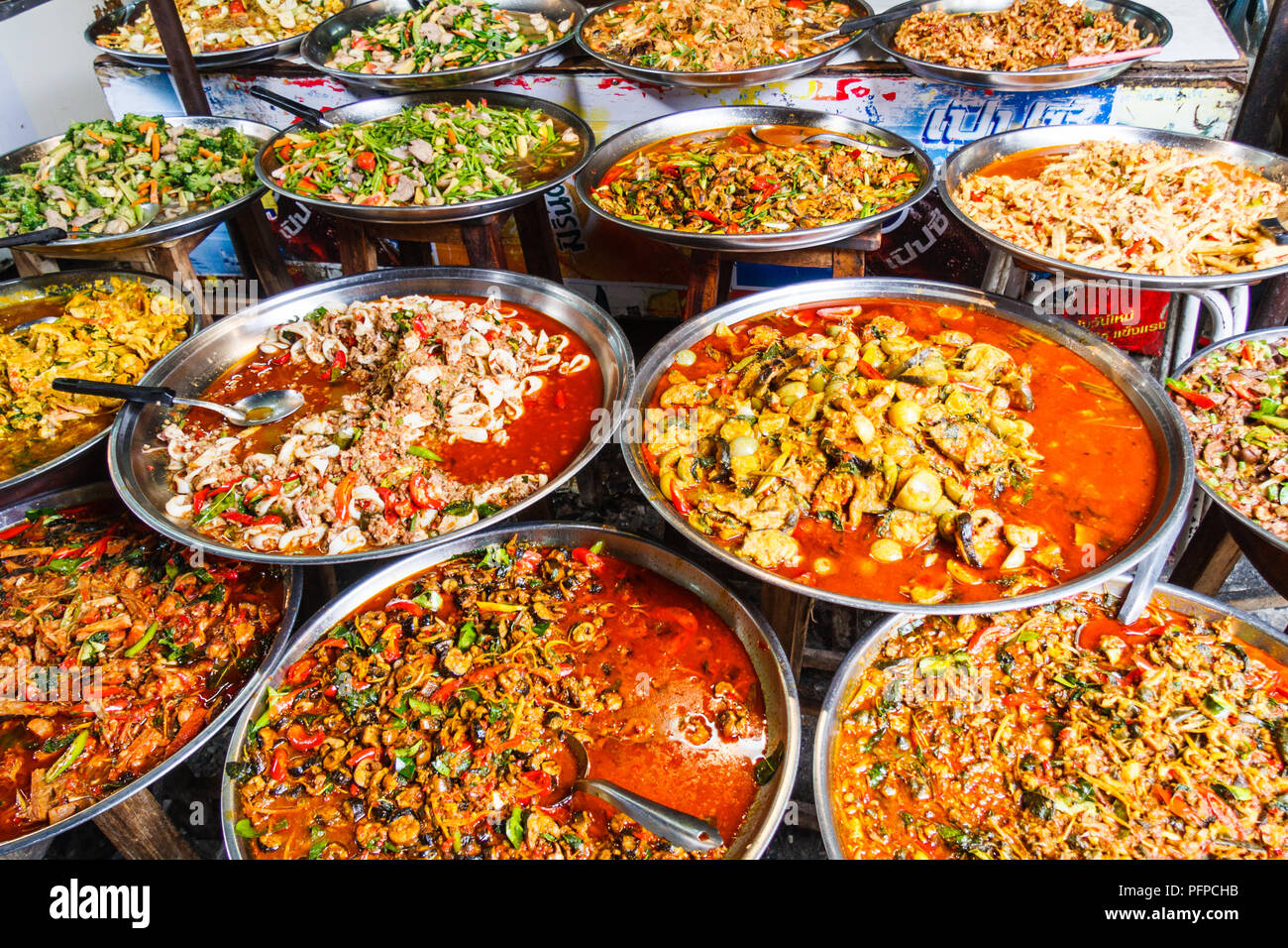 Platters of traditional Thai food for sale on street market stall ...