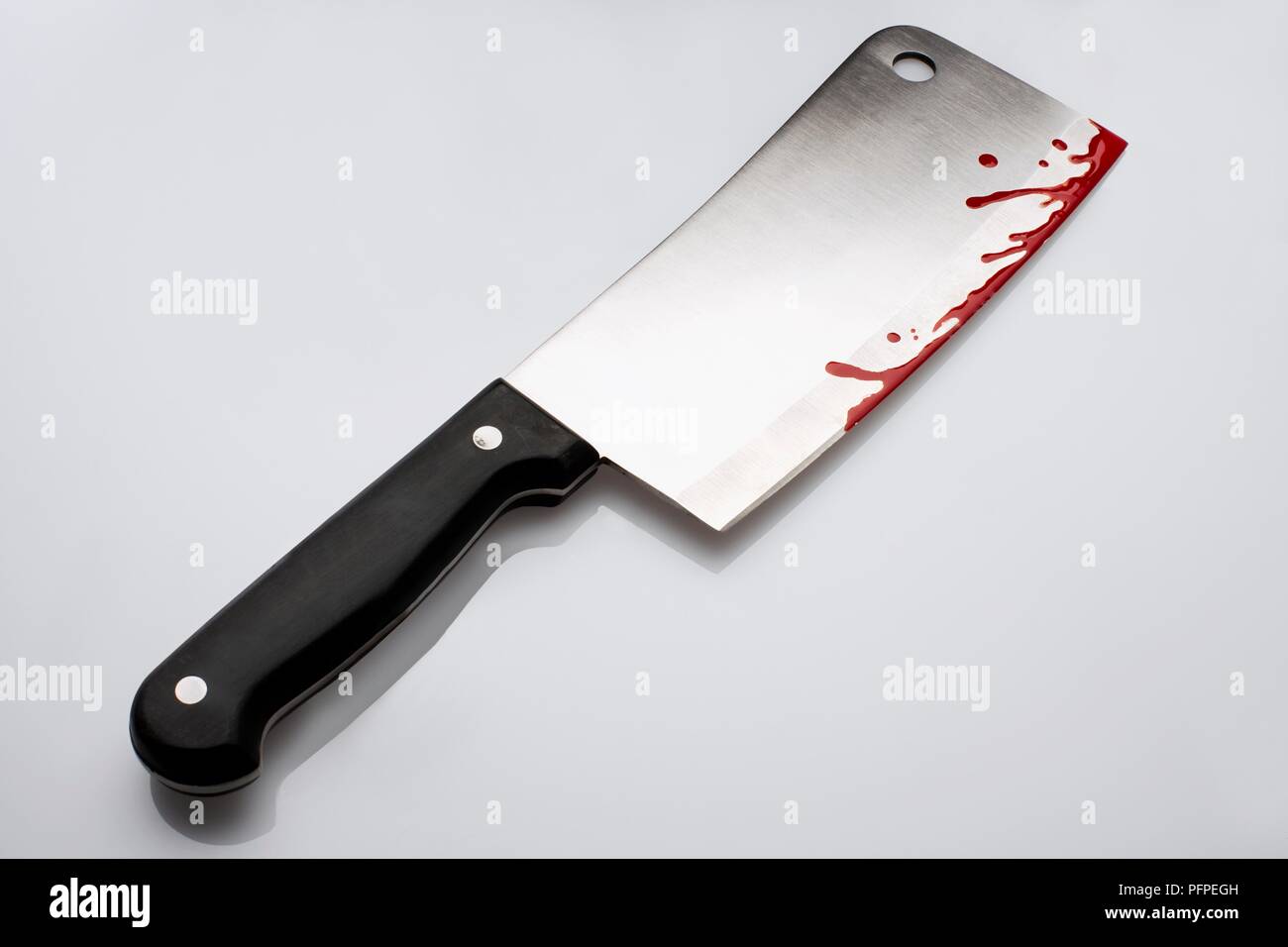 Fake blood on meat cleaver Stock Photo Alamy