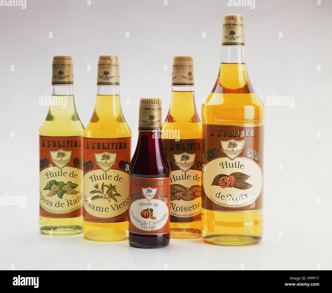 A bottle each of grapeseed oil, virgin sesame oil, virgin pumpkin seed oil, hazelnut oil and