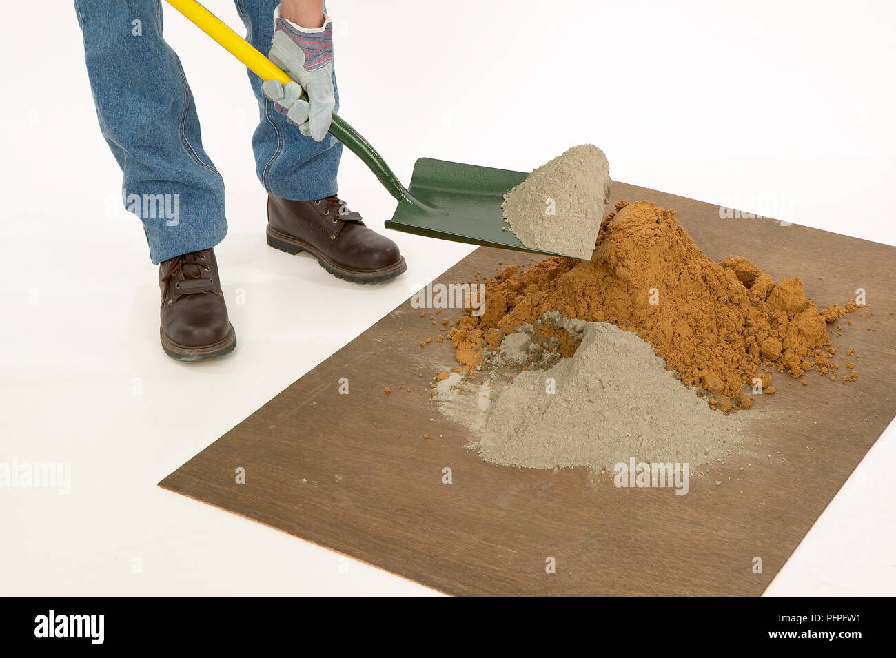 Mixing dry powdered ingredients of cement together Stock Photo Alamy