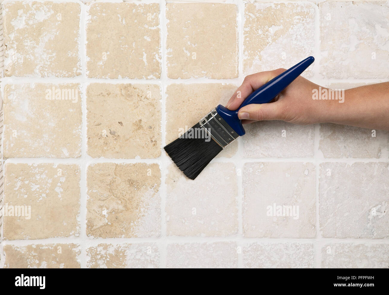 Hand painting tiles with sealant Stock Photo Alamy