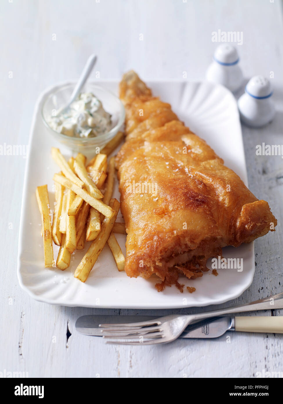 Deepfried haddock in beer batter with chips and tartare sauce Stock