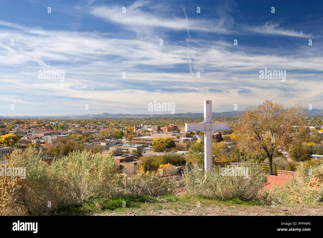 usa new mexico santa fe cross of the martyrs with view of city in city in background