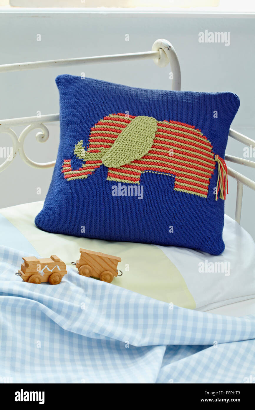 Knitted elephant cushion on bed, front view Stock Photo Alamy