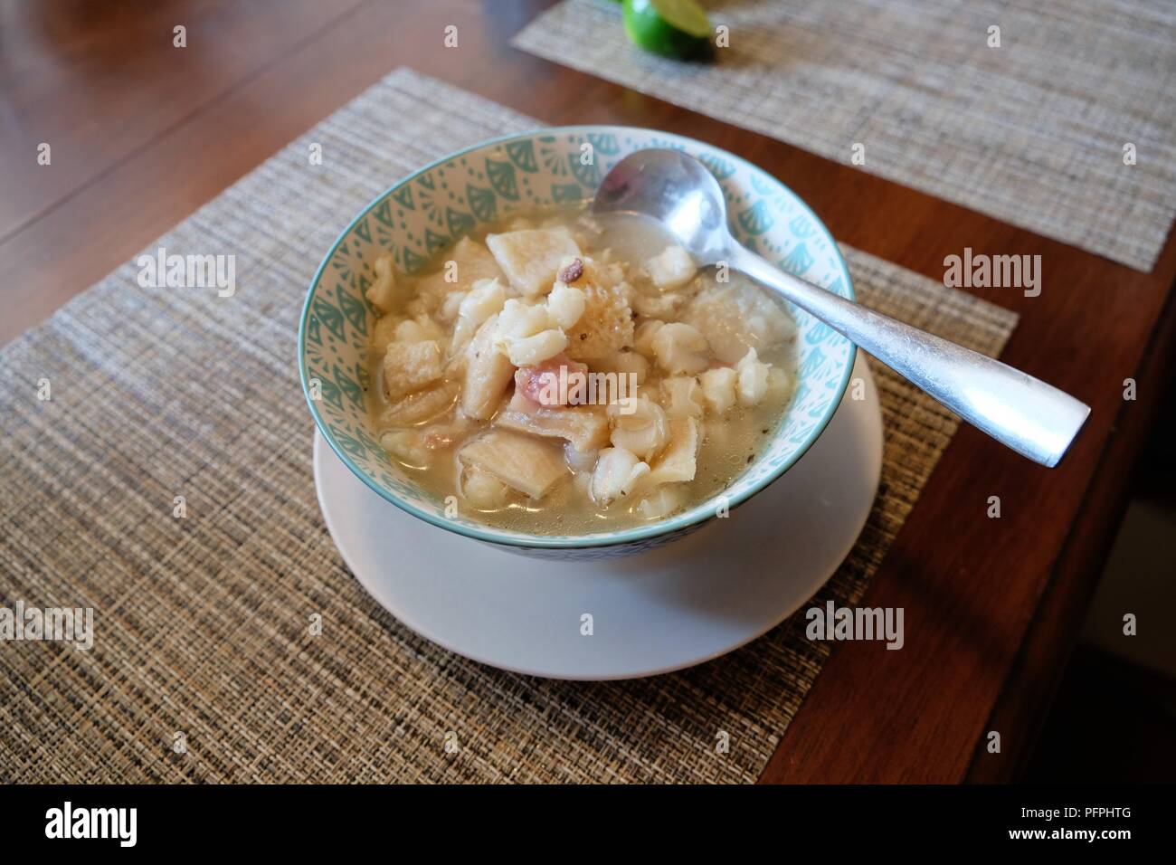Bowl of homemade menudo, a Mexican soup consisting of hominy, broth