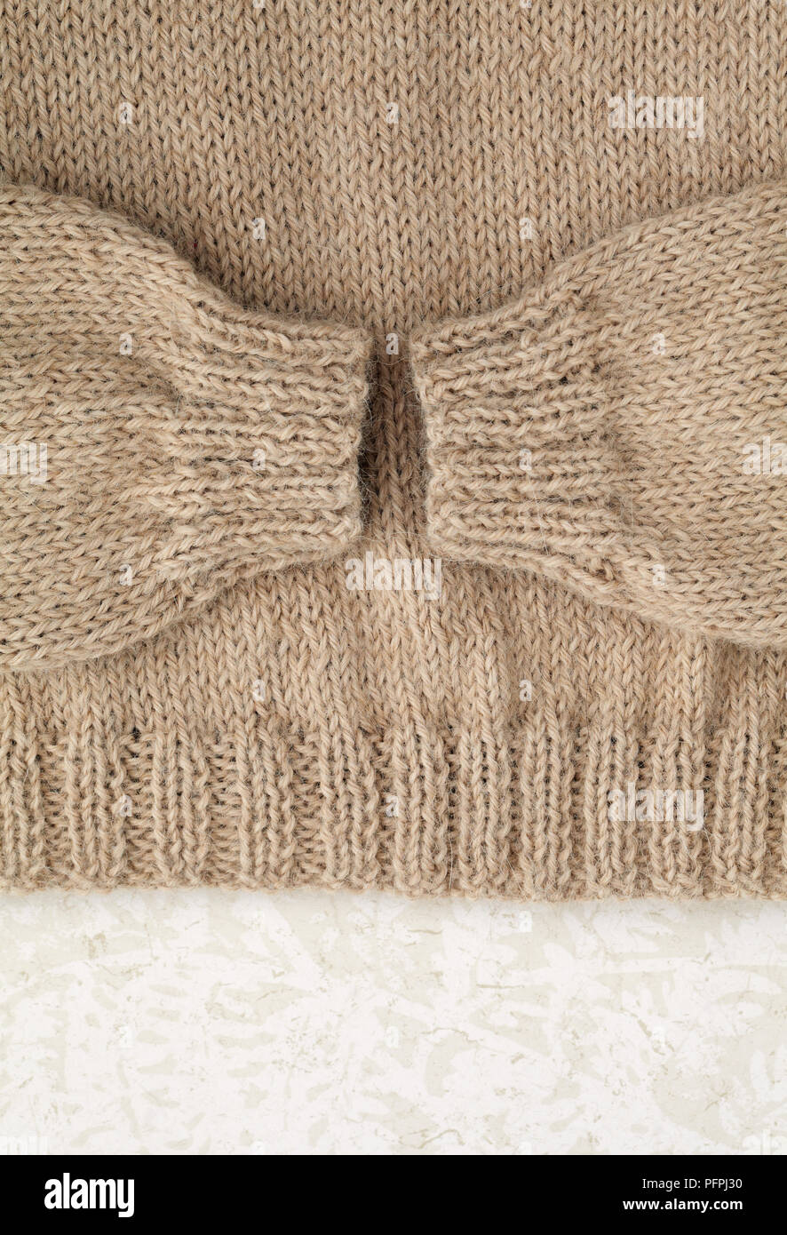 Beige alpaca sweater, sleeves and bottom edge Stock Photo