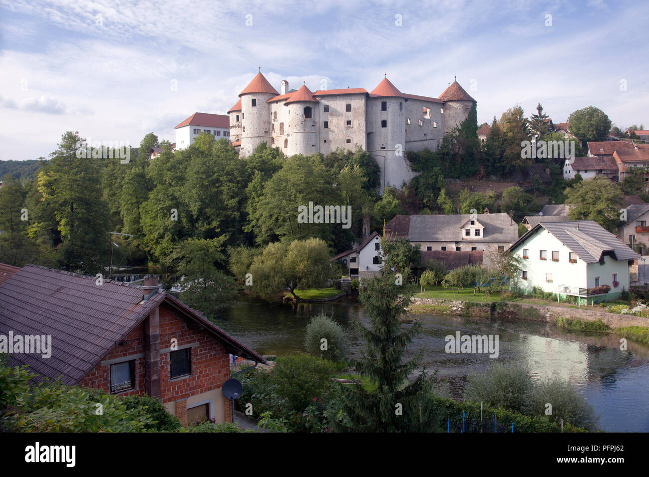 Slovenia, Zuzemberk, Zuzemberk Castle and Krka River Stock Photo - Alamy