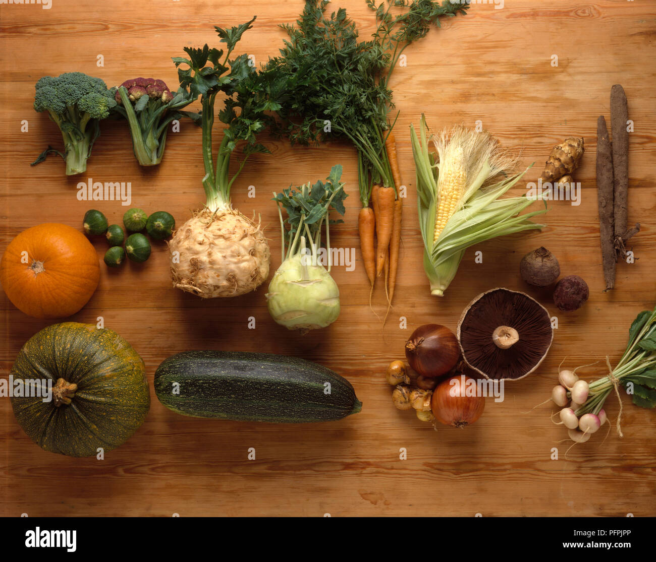 Selection of vegetables on wooden background Stock Photo
