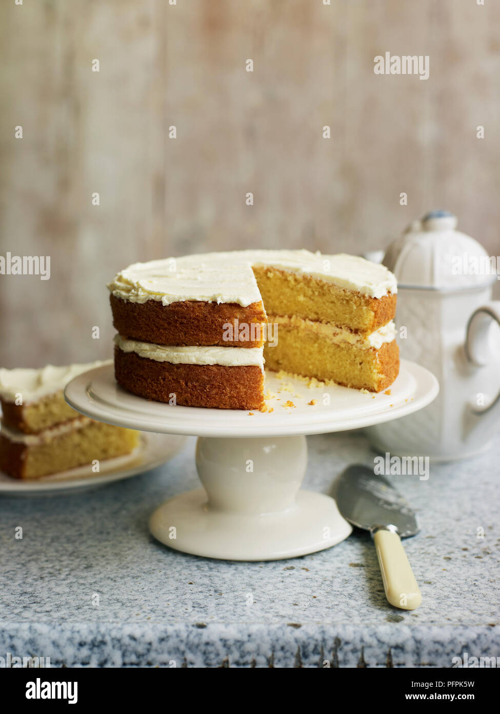 Victoria sponge cake on cakestand Stock Photo