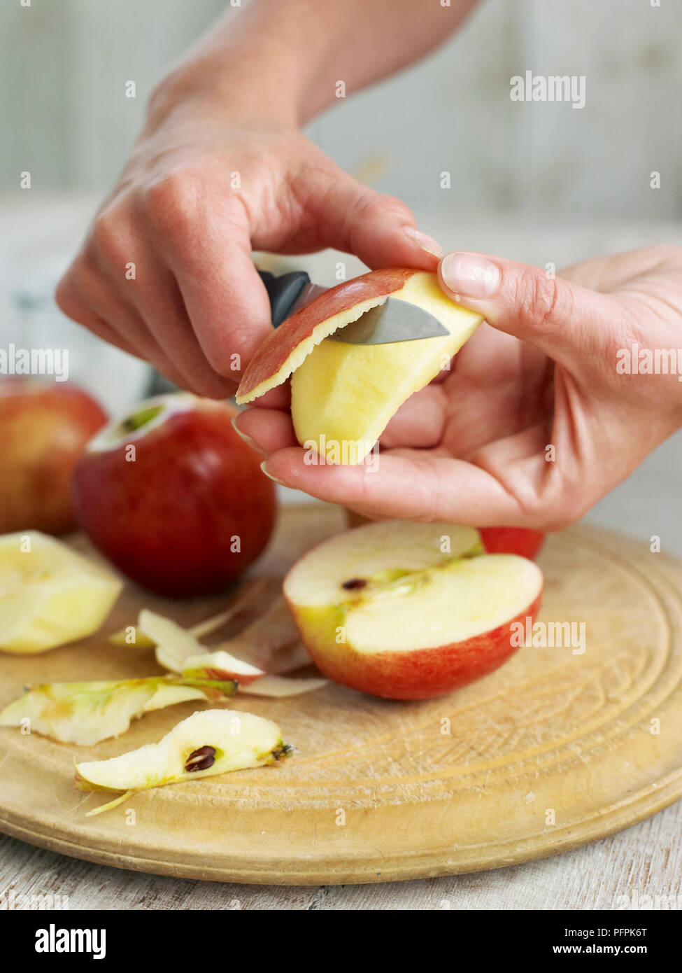 Peeling apples with knife Stock Photo