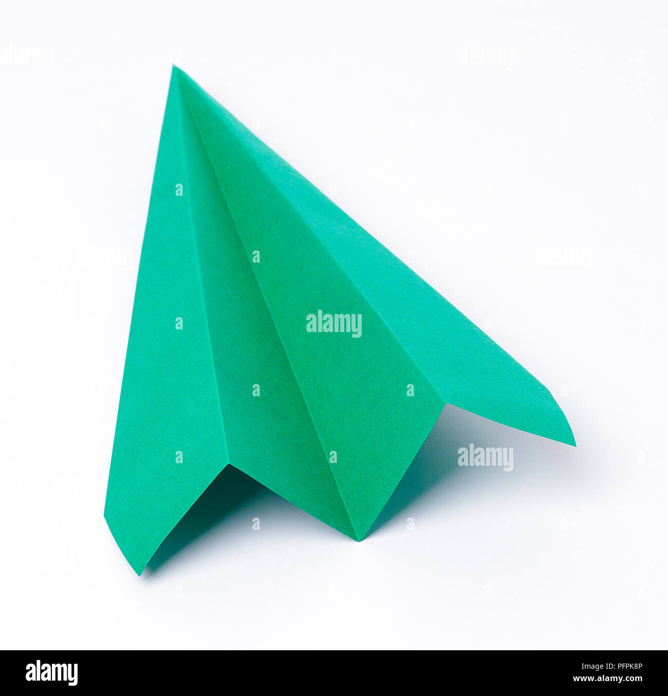 Green paper plane Stock Photo