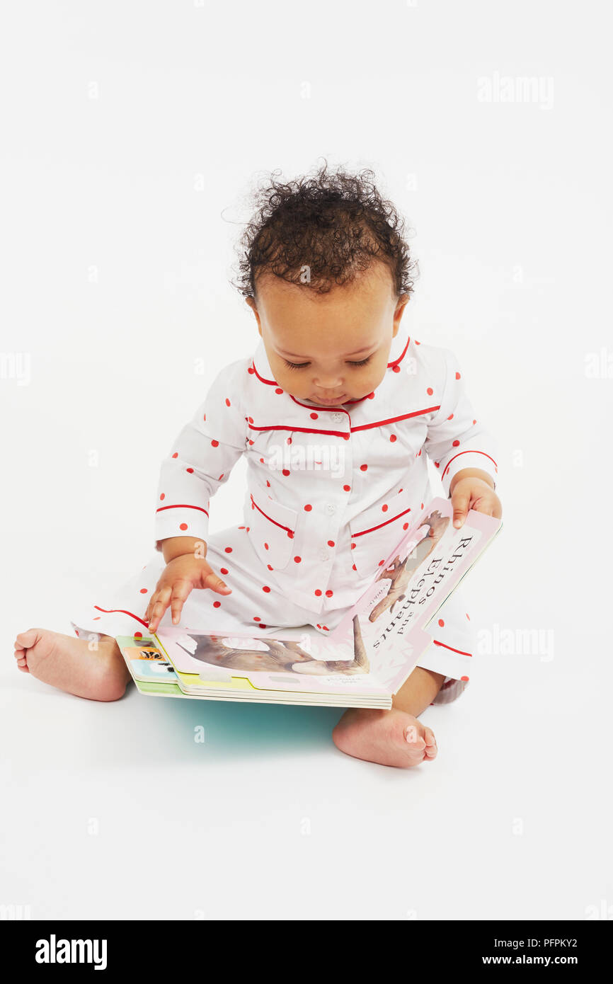 Baby reading books Stock Photo