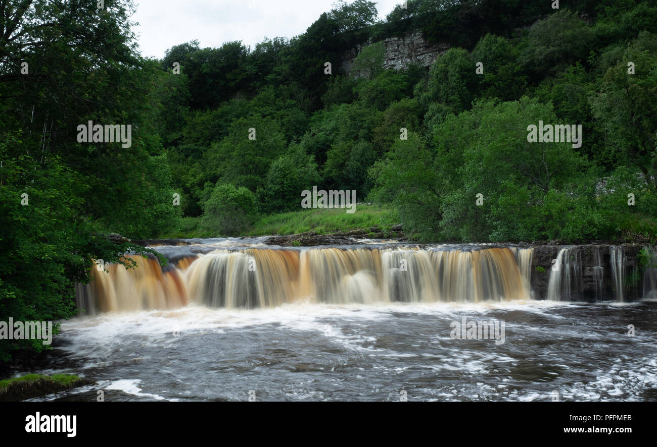 Wain Wath Force is a popular waterfall located just over half a mile to the west of Keld in upper Swaledale in the Yorkshire Dales National Park Stock Photo