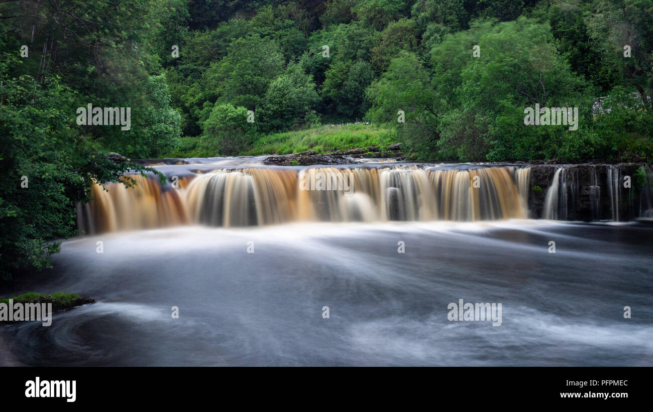 Wain Wath Force is a popular waterfall located just over half a mile to the west of Keld in upper Swaledale in the Yorkshire Dales National Park Stock Photo