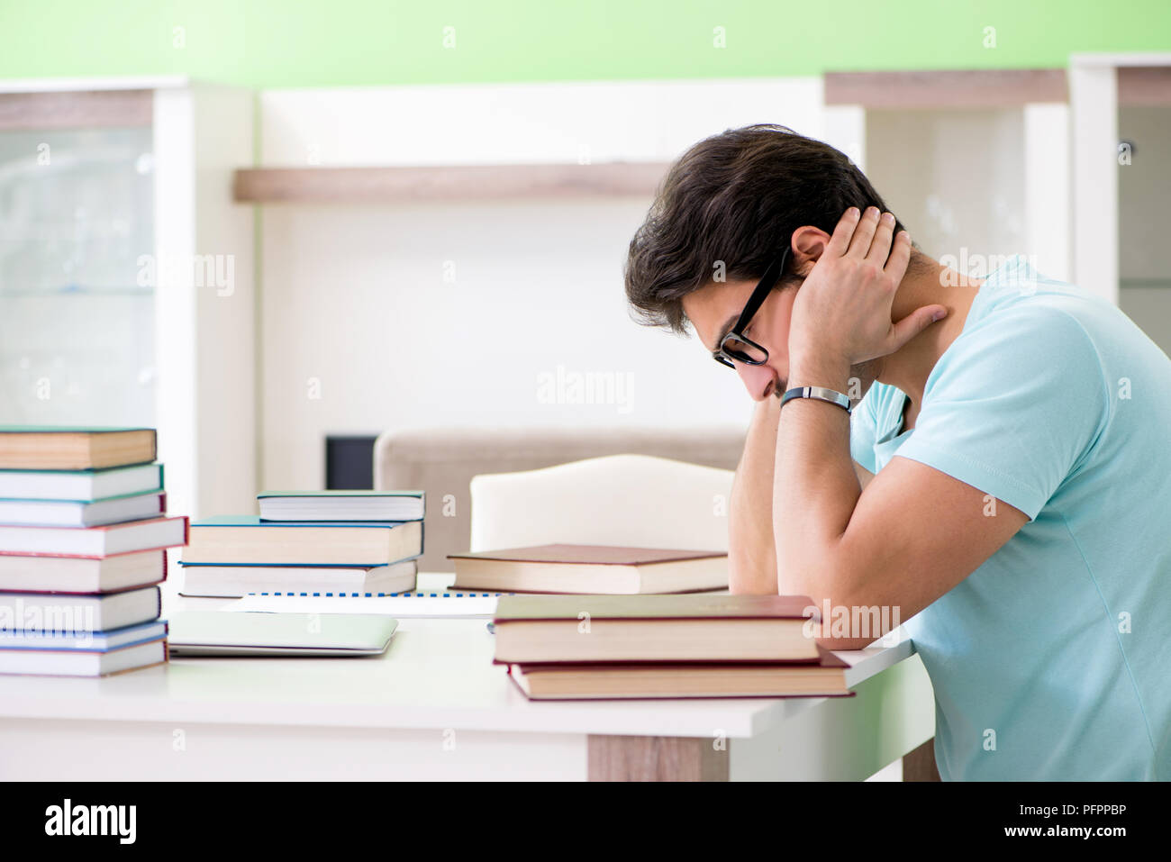 Student preparing for university exams at home Stock Photo - Alamy