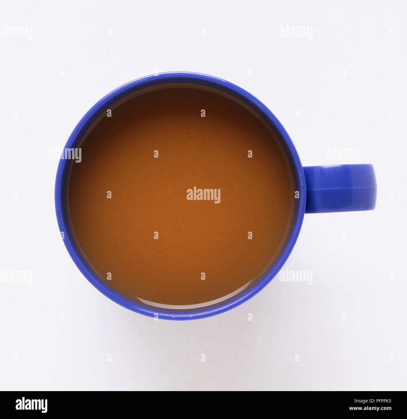 Hot drink in a blue mug, view from above Stock Photo