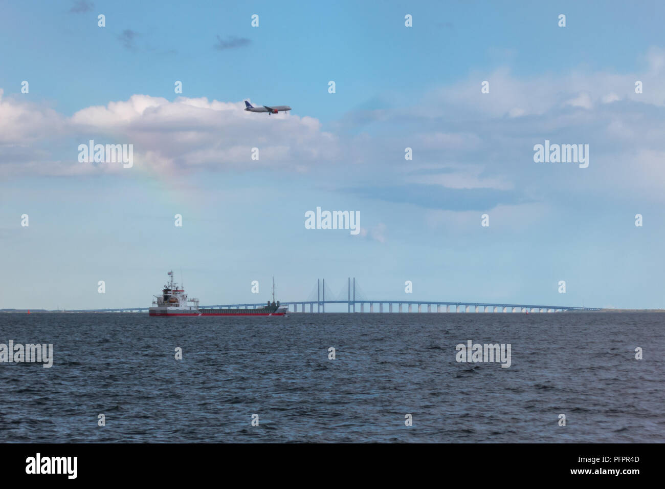 Photograph of a ship, aircraft and motorway bridge, showing different ways of transportation and means of global trade causing large carbon footprint Stock Photo