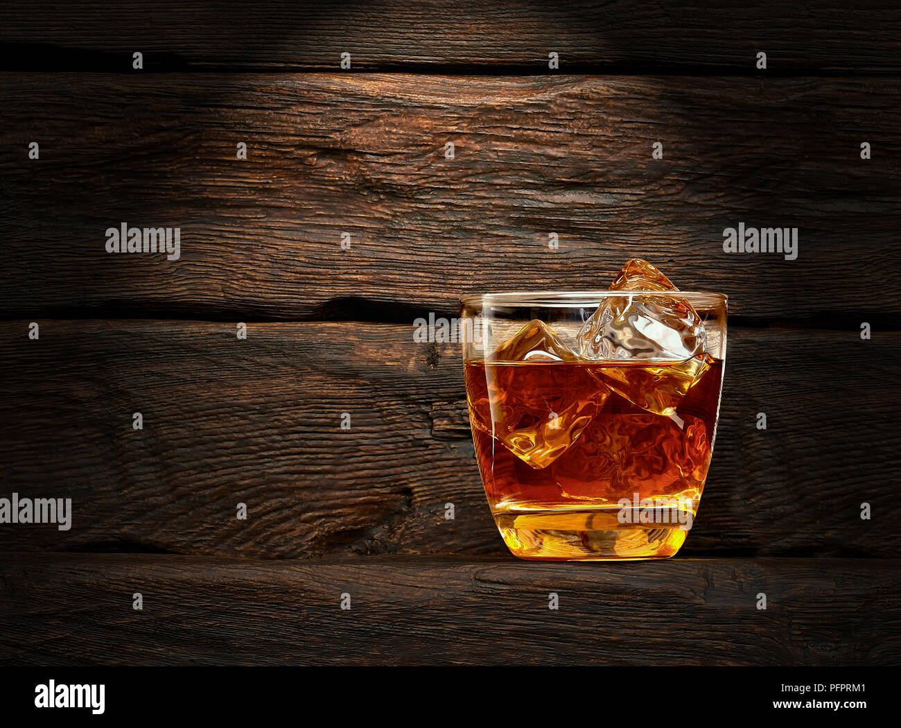Cola with whiskey on wooden background with copy space Stock Photo