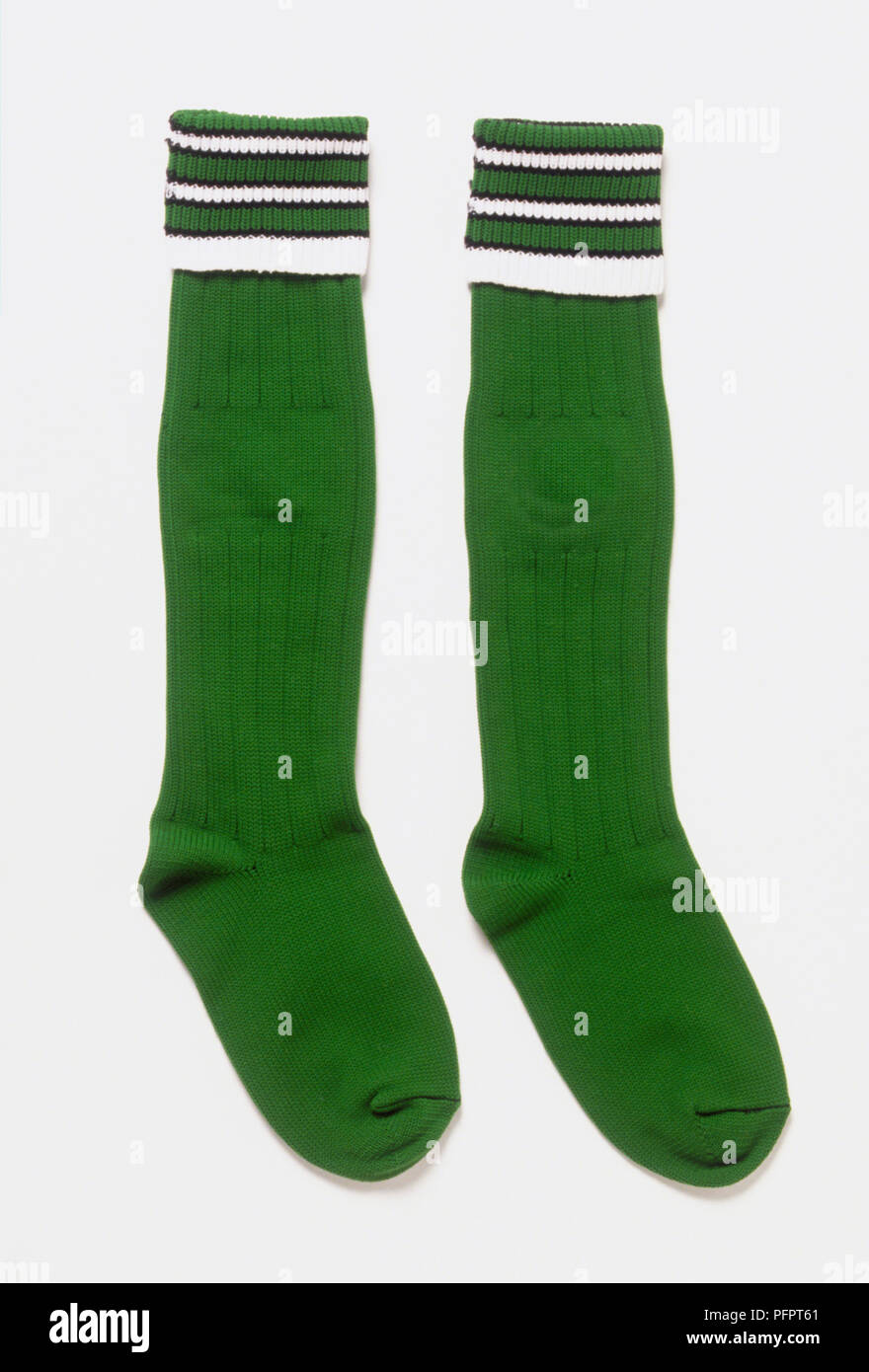 Pair of long, green and white striped socks Stock Photo