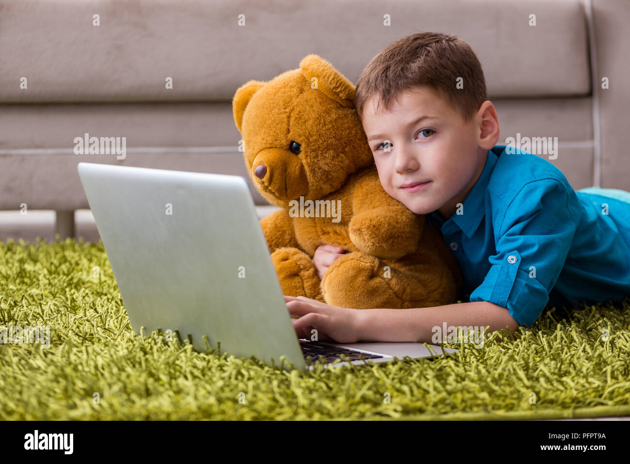 Little boy surfing internet on laptop Stock Photo - Alamy