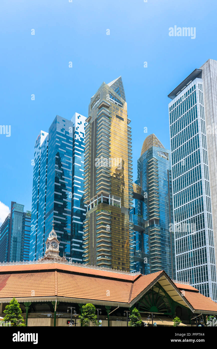 Singapore  - August 11, 2018: Condominium, financial and bank buildings with old in front Stock Photo