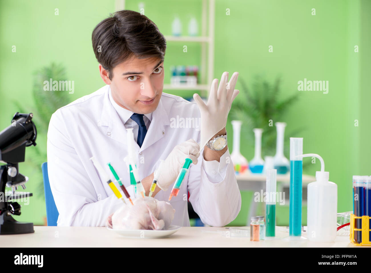 Lab assistant testing GMO chicken Stock Photo Alamy
