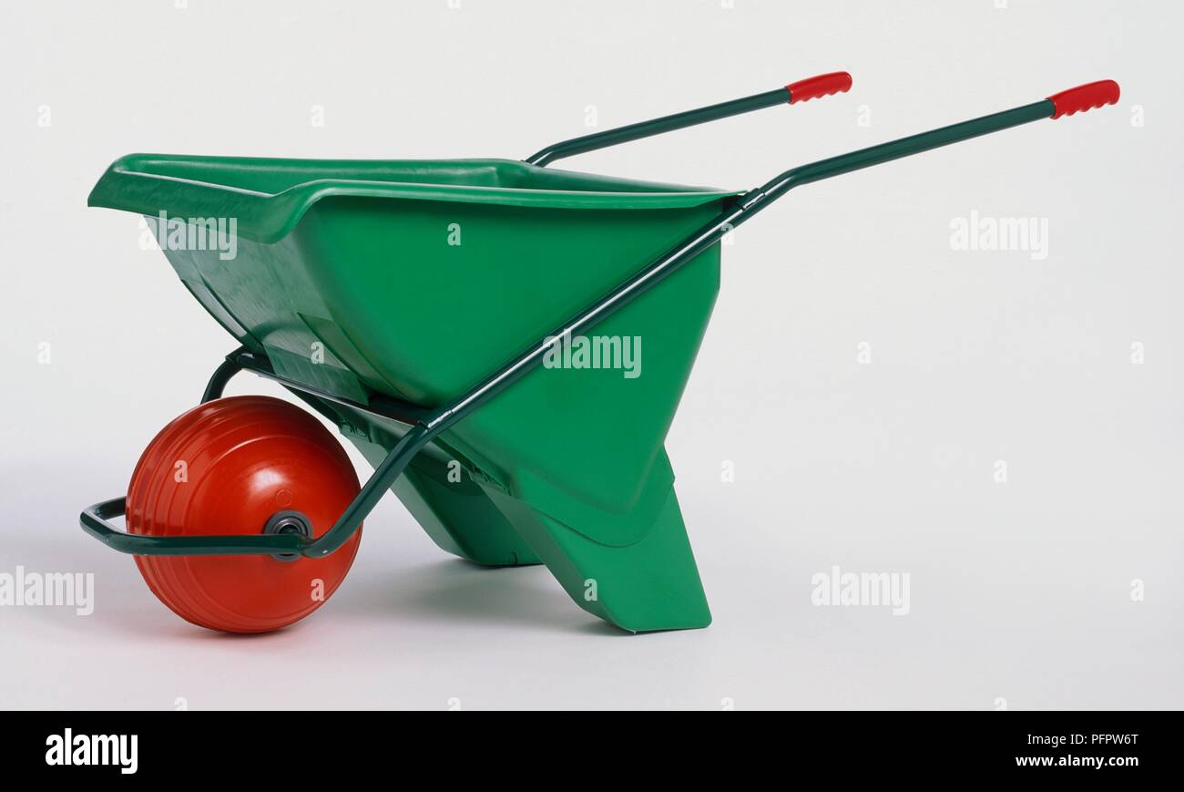 Ball-wheeled wheelbarrow, side view Stock Photo - Alamy
