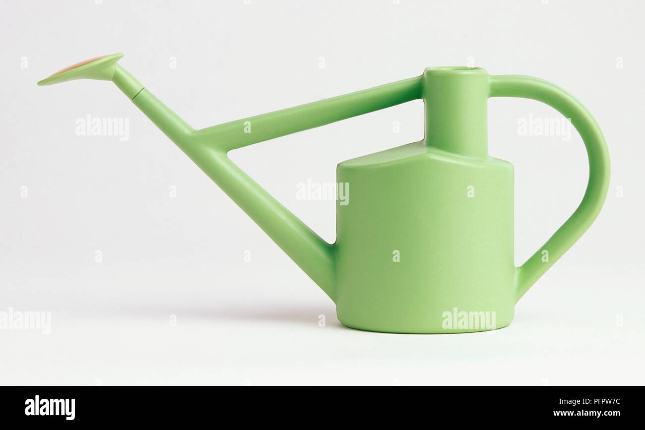 Pastel green plastic watering can with spout Stock Photo