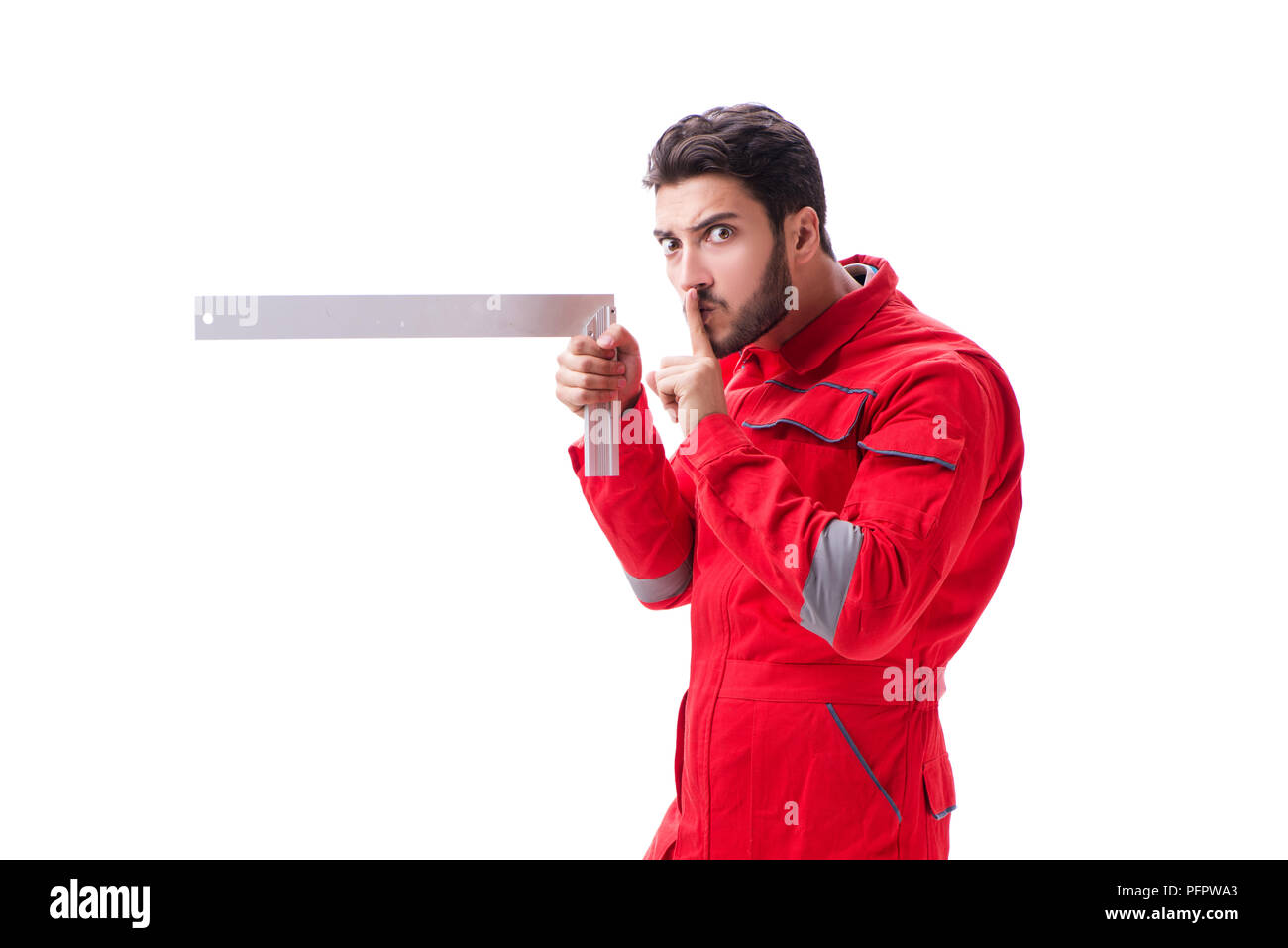 Young repairman with a square ruler isolated on white background Stock ...