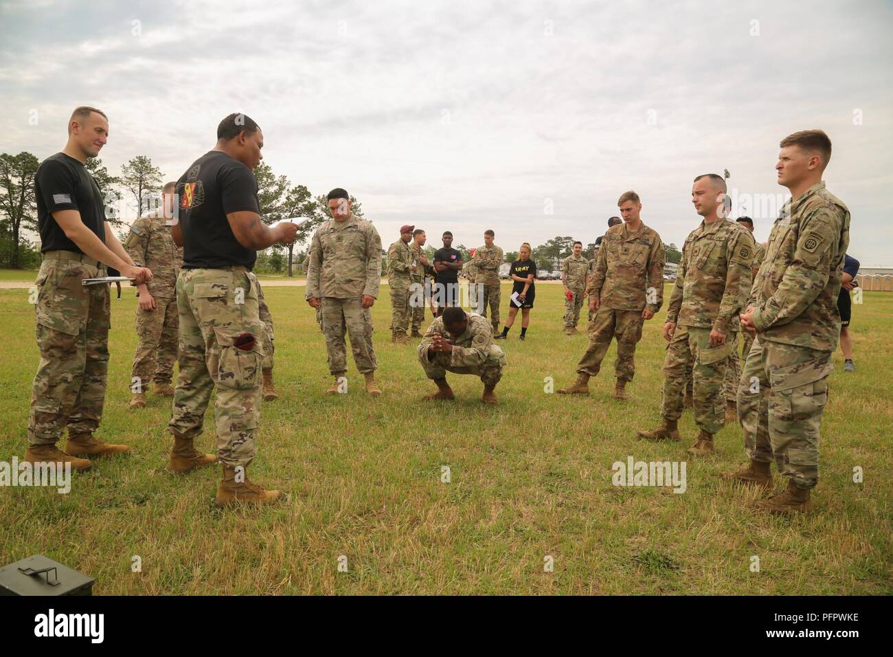 U.S. Army Paratroopers recieve a briefing before starting the Combat Fitness Test on Pike Field at Fort Bragg, N.C., May 21, 2018. During All American Week XXIX, paratroopers from all over the 82nd Division compete in a series of events, The Combat Fitness Test is an event designed to test a Paratrooper's functional fitness and gives a more accurate representation of what Paratroopers are trained to do. Stock Photo