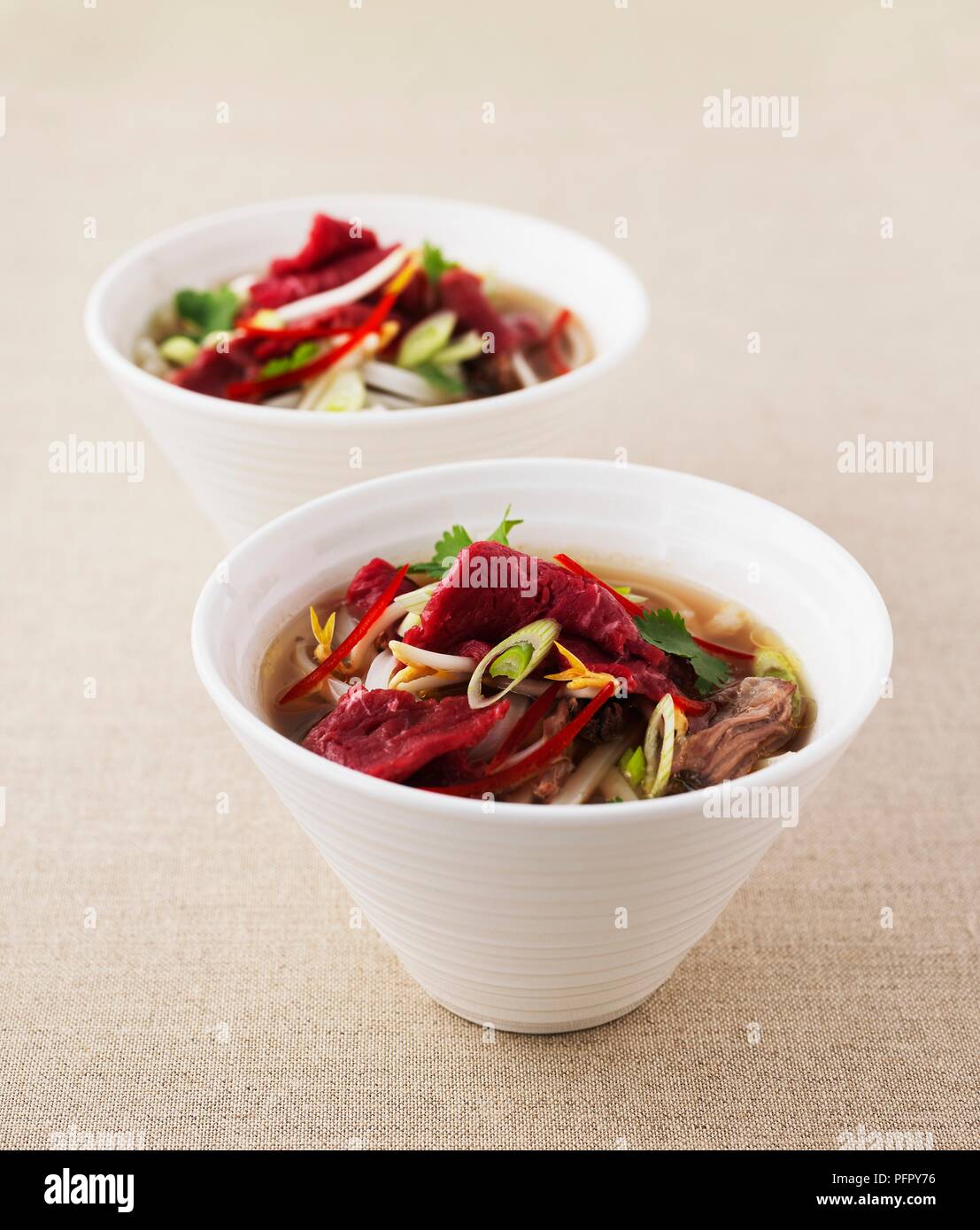 Beef noodle soup in bowls, closeup Stock Photo Alamy