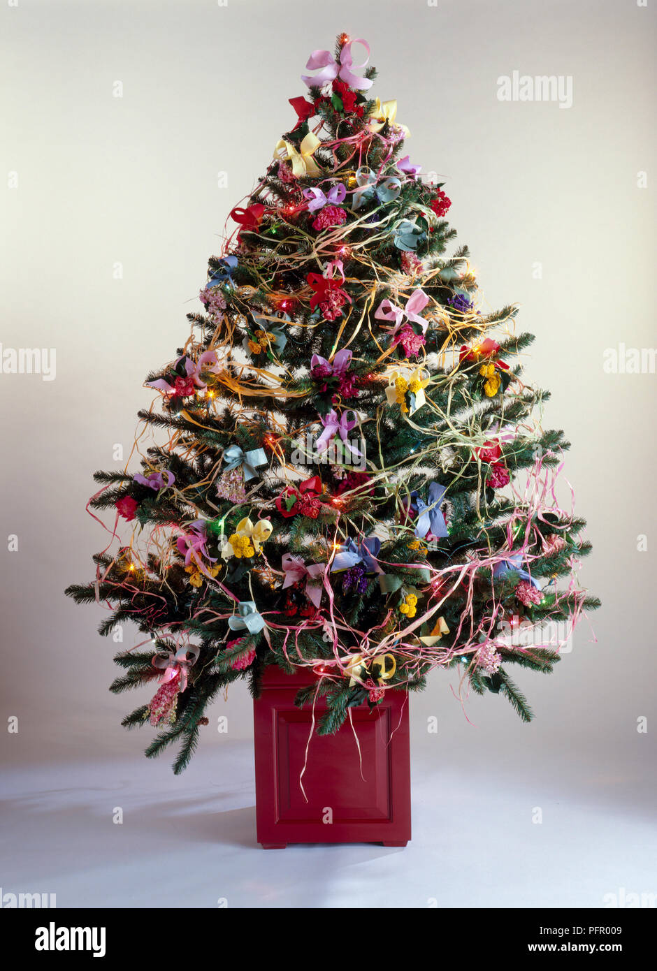 A Christmas tree covered in dried flower decorations Stock Photo